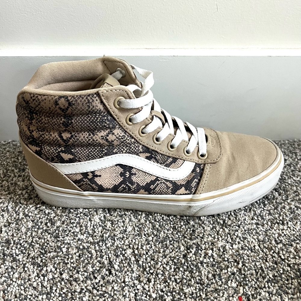 Vans women’s snakeskin high tops, size 8, used but in great condition.